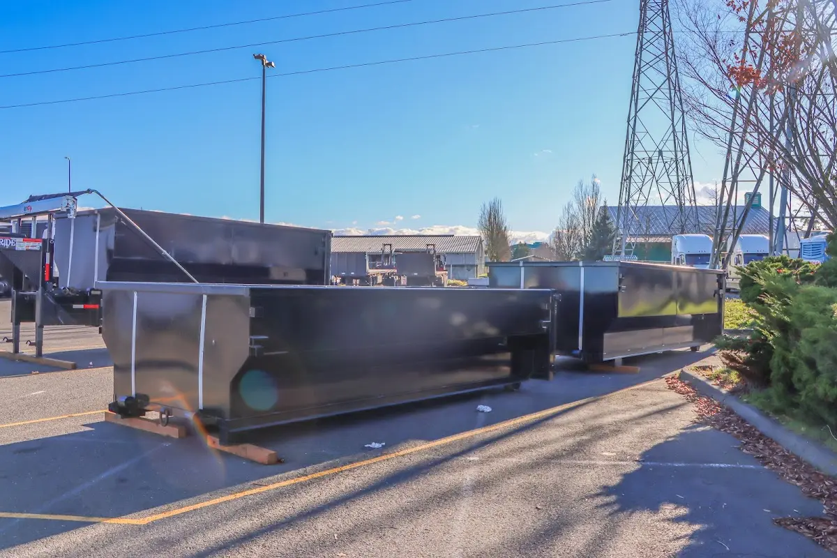 Roll-off dumpster ready for waste disposal at job site for Demolition Dumpster Rental in Leland